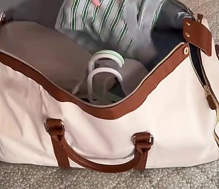 The Luhxe Travel Bag open and packed, shoes sitting in their own compartment with folded clothes alongside