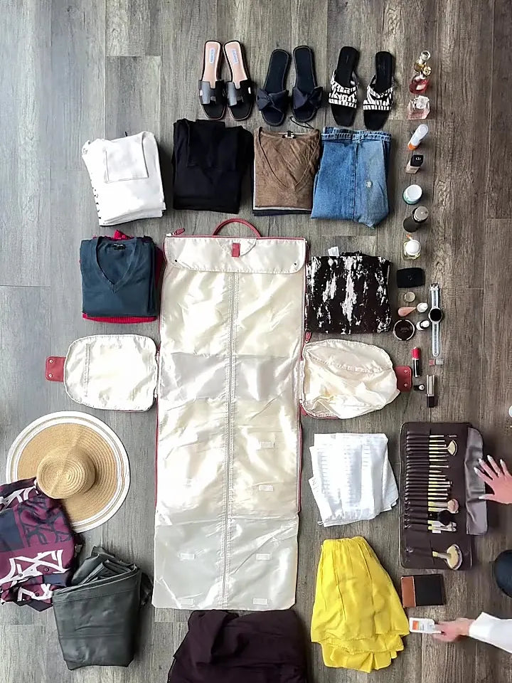 Ten days of clothing, shoes, toiletries and accessories laid out on the floor beside the open garment compartment of the Luhxe Travel Bag